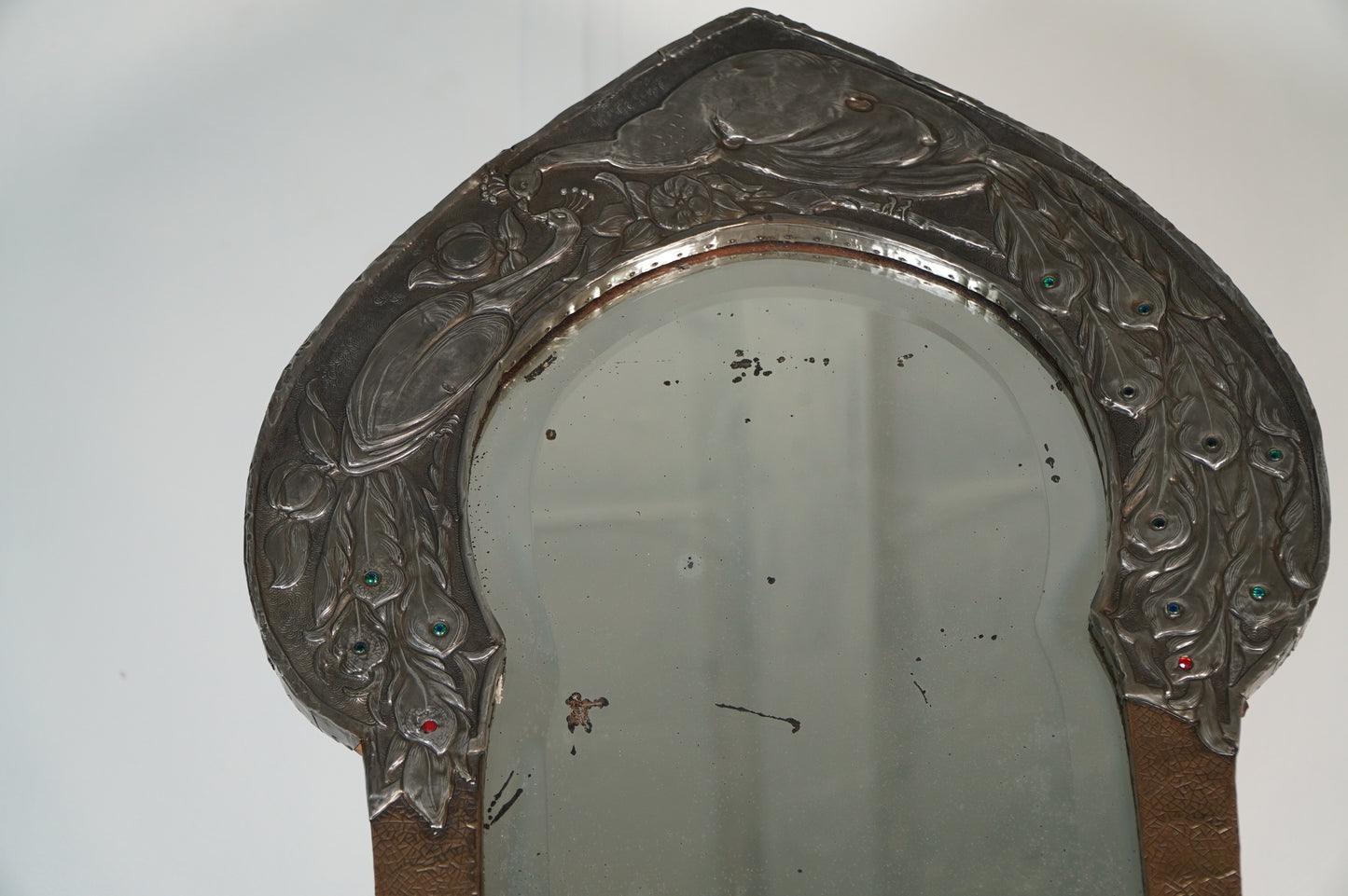 glasgow school Nouveau Mirror with Embossed Metal Frame and Peacock Feather Design